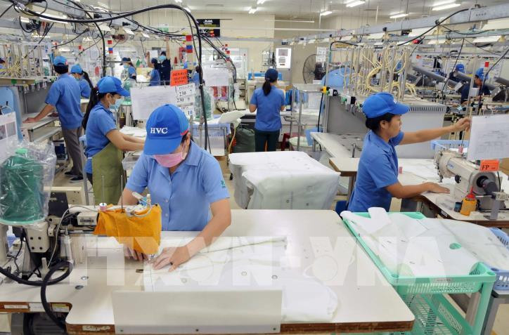 Người lao động đang làm việc tại một doanh nghiệp ở khu công nghệ cao TP. Hồ Chí Minh